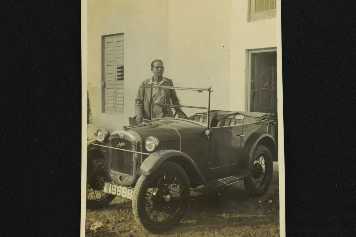 Rich man standing with his own austin classic vintage car