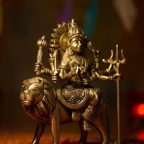 Bronze sculpture of a Goddess sitting on a lion