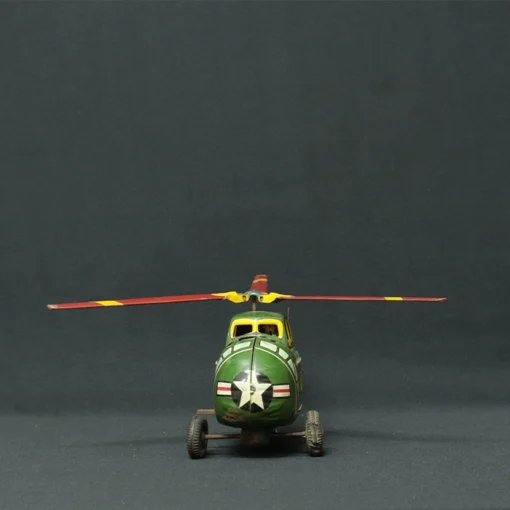 us army tin toy helicopter front view