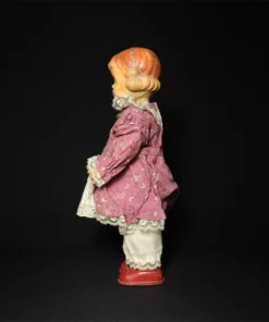 doll tin toy side view
