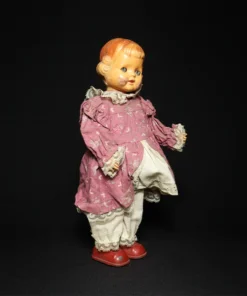 doll tin toy side view 3