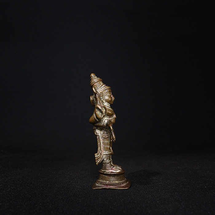 antique god vishnu bronze sculpture side view
