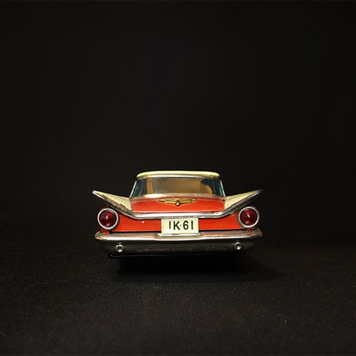 vintage friction masudaya tin toy buick car back view