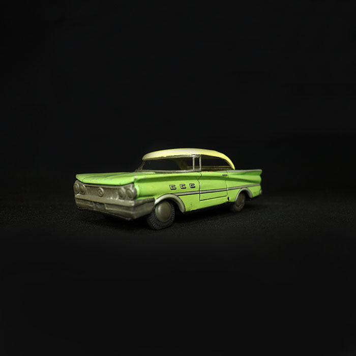 vintage tin toy buick car half side view