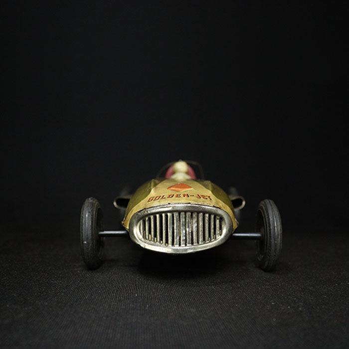 vintage tin toy golden jet car front view