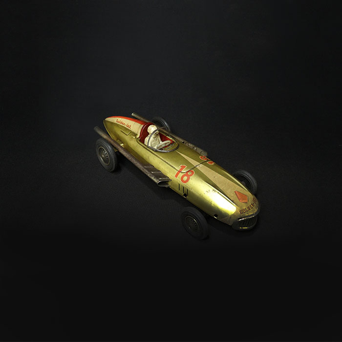 vintage tin toy golden jet car top view
