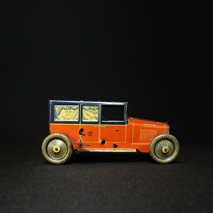 vintage tin toy sedan car side view