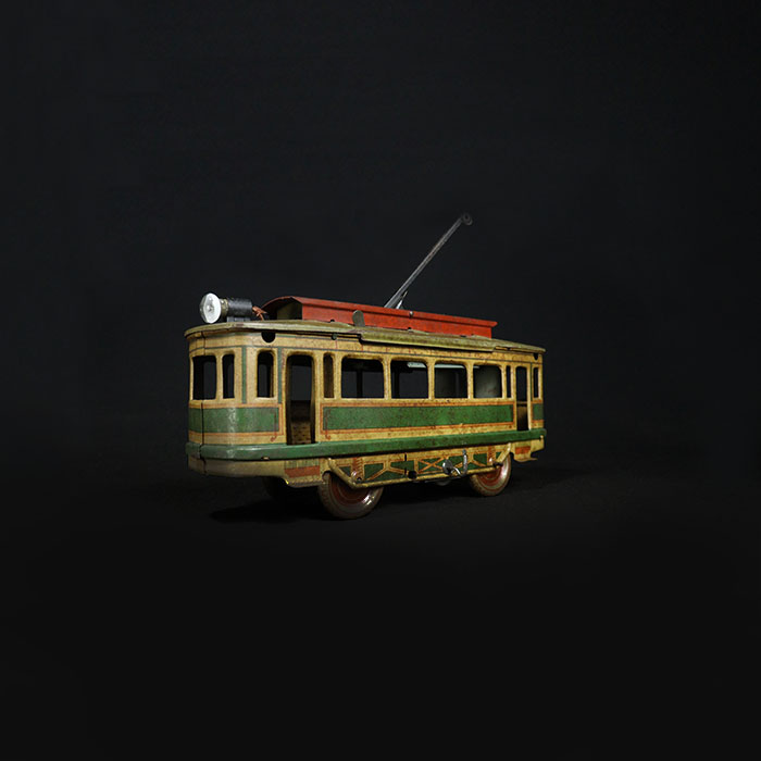 vintage tin toy tram train half side view