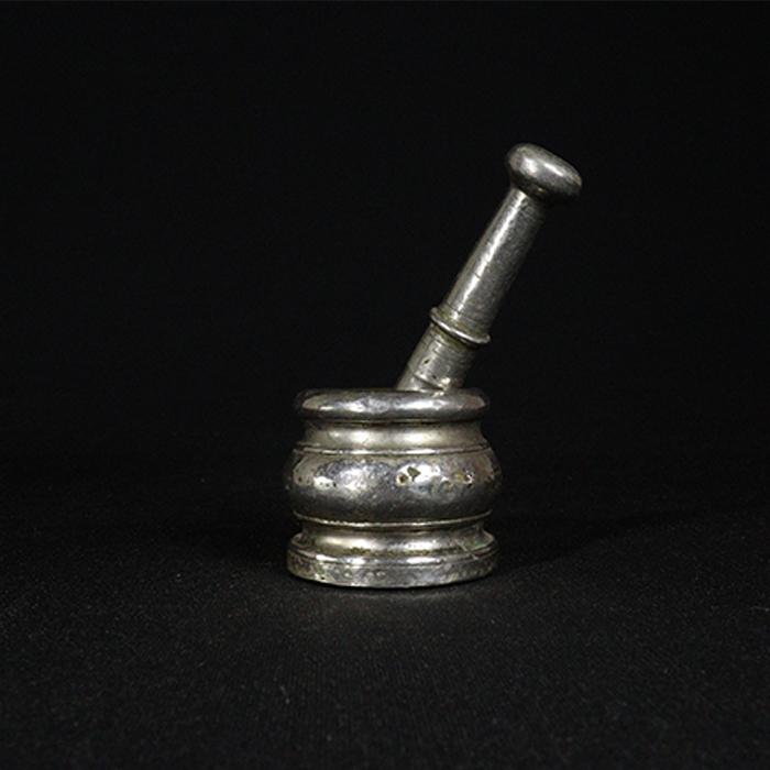 mortar and pestel bronze collectible side view