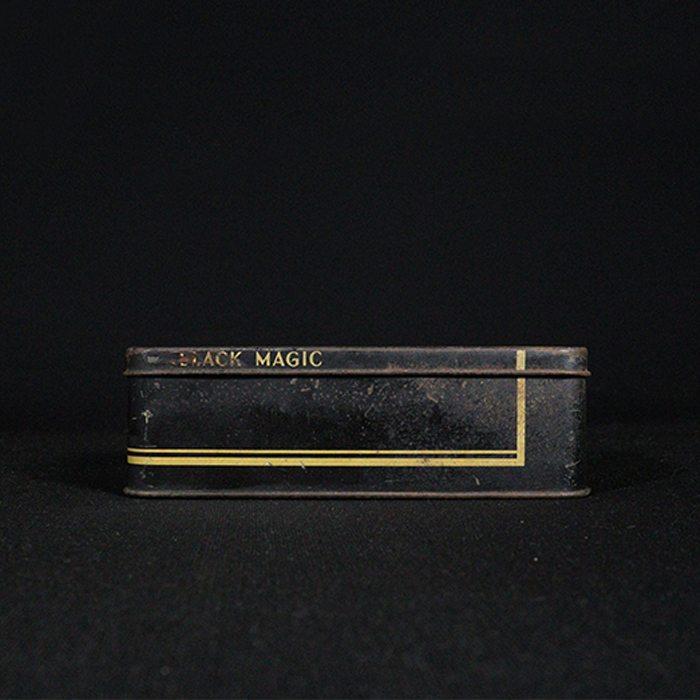 black magic tin box front side view