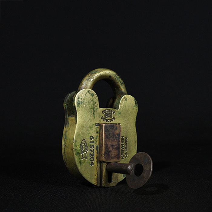 chubbs detector padlock bronze collectible half side view 2