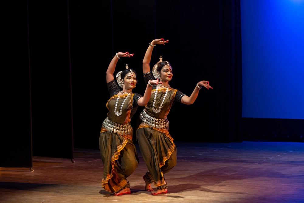 two women performing kathakali dance